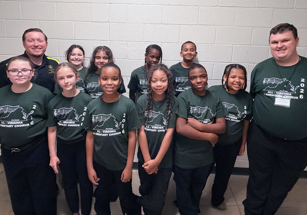 Richneck music teacher Jon Sims (far left) and Discovery STEM Academy music teacher Zachary Erhard (far right) and students at All-Virginia Elementary Chorus.