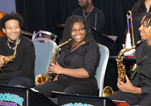 Thred NNPS students smile during music performance.