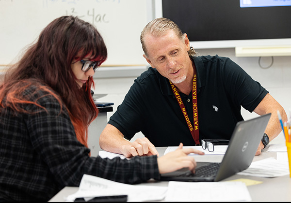 Teacher of the Year John Lovett instructing a student.